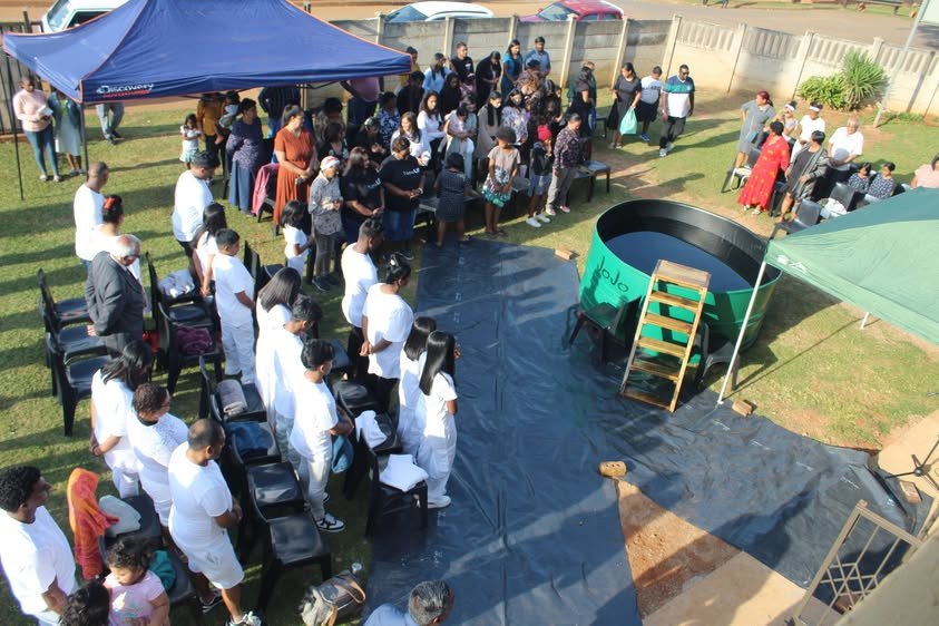 The church gathered around the baptism pool